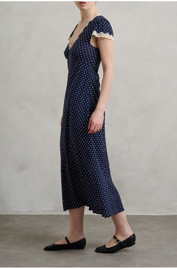 clarice dress in navy polka dot